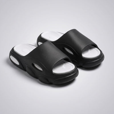 FORCIANO GLOW black and white Height Increasing Slippers for Women shown as a pair from a front three-quarter angle with cushioned footbeds visible.