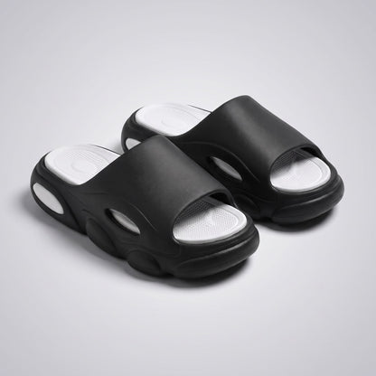FORCIANO GLOW black and white Height Increasing Slippers for Women shown as a pair from a front three-quarter angle with cushioned footbeds visible.
