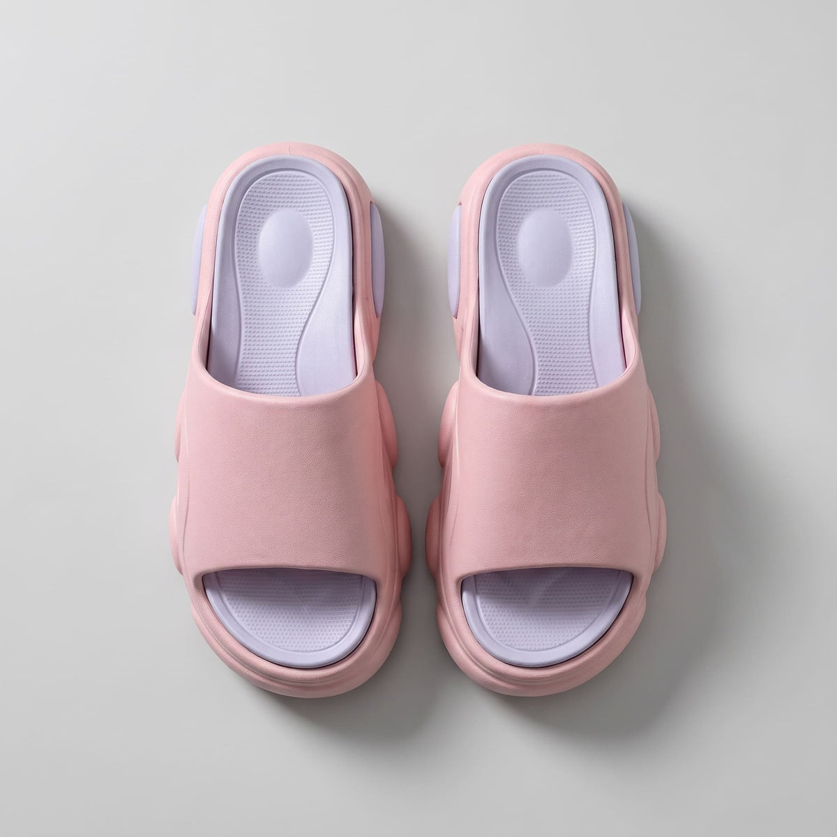 FORCIANO GLOW pink and purple Height Increasing Slippers for Women shown in a top-view pair with textured purple footbeds and wide pink straps.