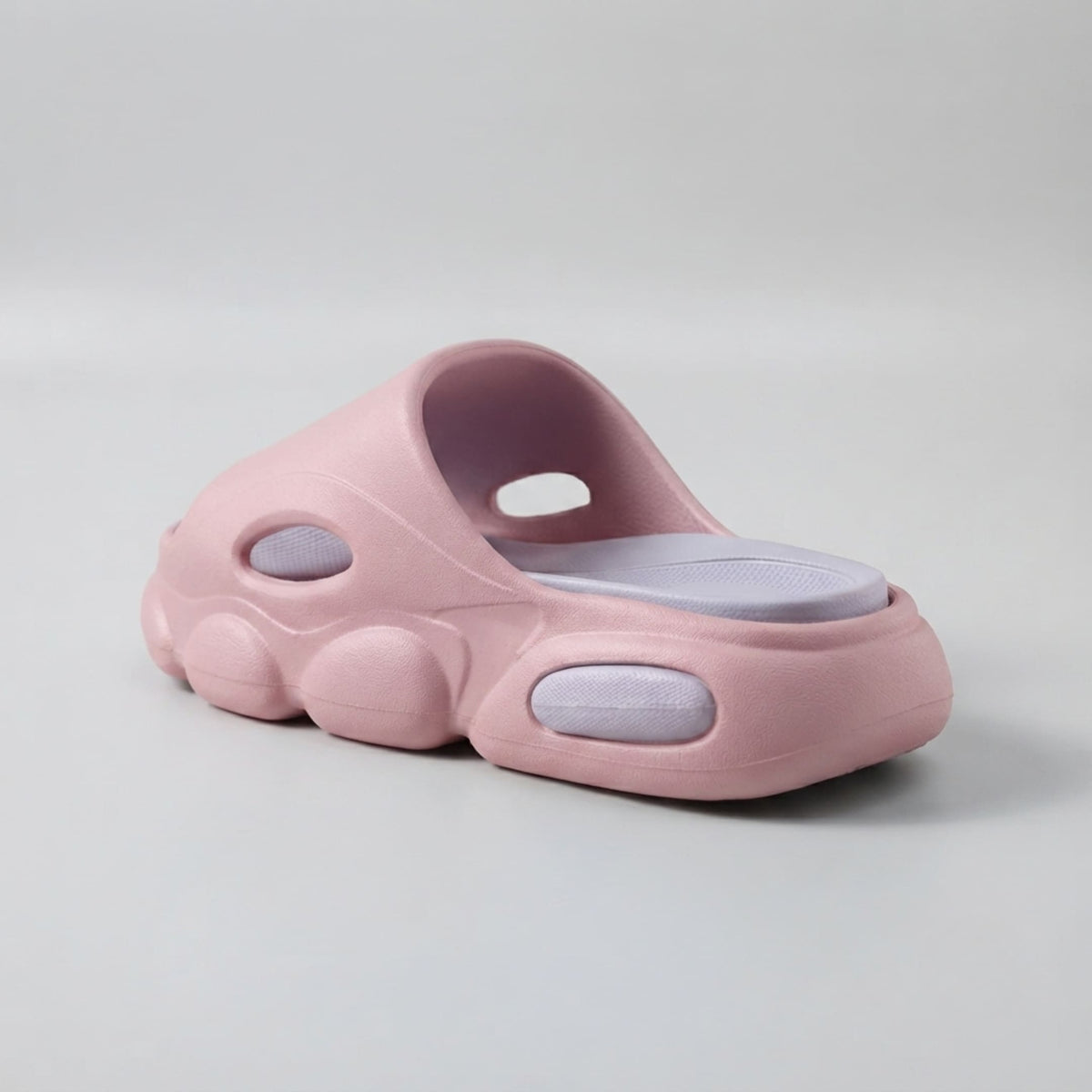 FORCIANO GLOW pink and purple Height Increasing Slippers for Women shown from a rear three-quarter angle with the cushioned purple footbed and sculpted EVA sole.