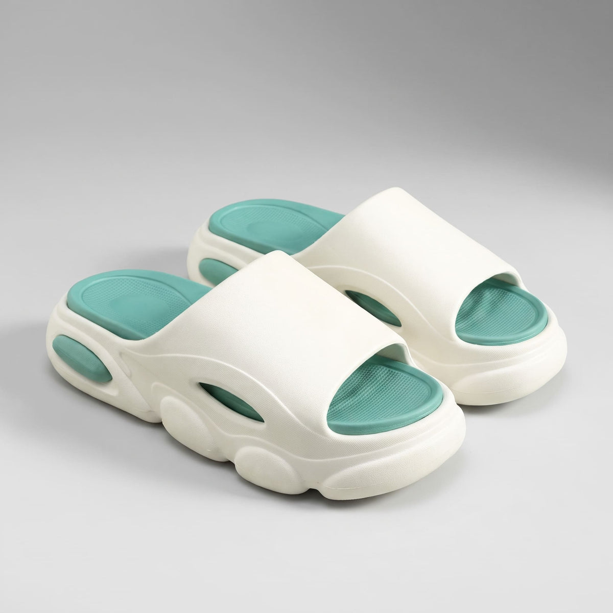 FORCIANO GLOW white and green Height Increasing Slippers for Women shown as a pair from a front three-quarter angle with green cushioned footbeds.