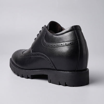 FORCIANO GRANDIOR black Height Increasing Shoes shown from a rear three-quarter angle with premium leather upper and perforated side detailing.