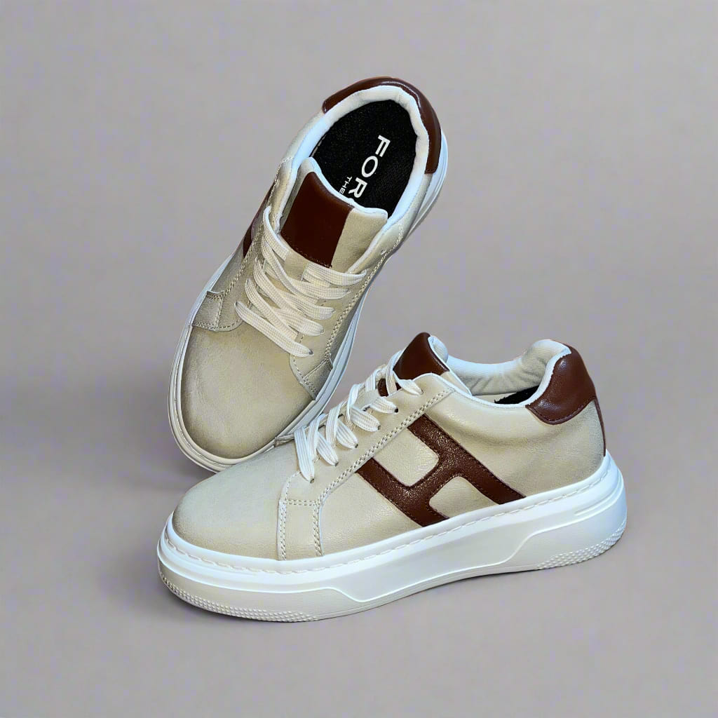 Pair of FORCIANO HERCULES beige premium leather Height Increasing Sneakers shown from a front three-quarter and top angle with brown detailing and white soles.
