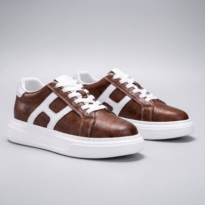 Pair of FORCIANO HERCULES brown premium leather Height Increasing Sneakers in a front three-quarter view with white side accents and soles.