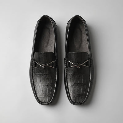 Top view of black leather FORCIANO HERITAGE Elevator Loafers arranged side by side, displaying their square toes, metal accents and interior lining.