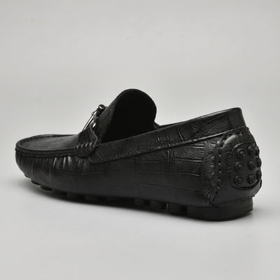 Rear three-quarter view of a black leather FORCIANO HERITAGE Elevator Loafer showing the textured upper, stitched heel panel and rubber grip studs.