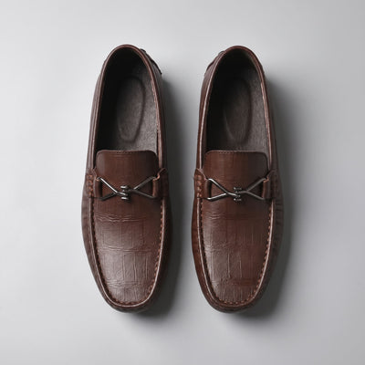 Overhead view of brown leather FORCIANO HERITAGE Elevator Loafers showing both shoes, textured leather uppers, stitched toe edges and metal hardware.