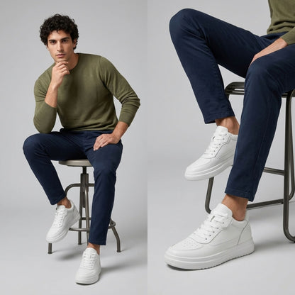 FORCIANO IMPACT white height boosting sneakers with leather upper shown on a seated male model in a casual lifestyle view.