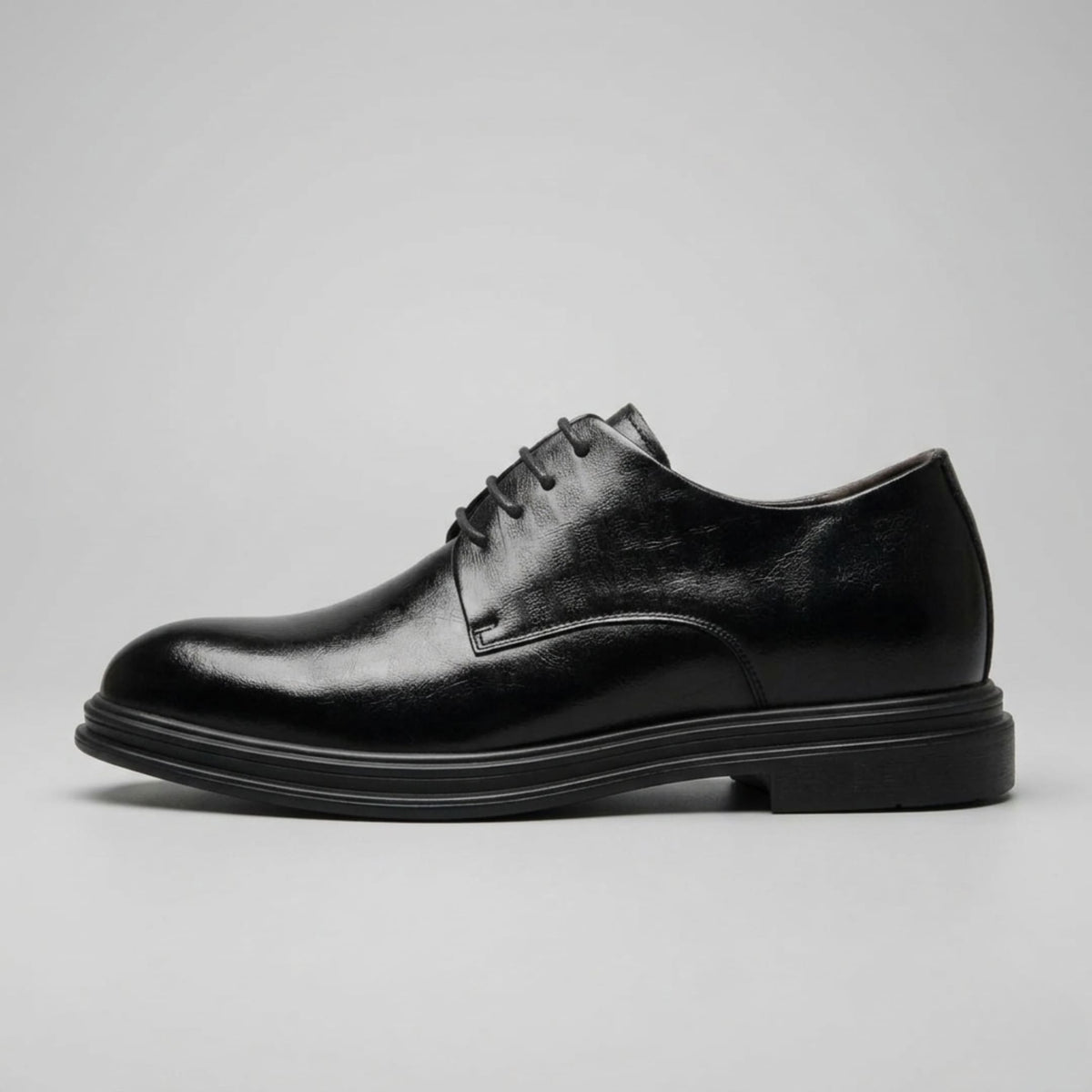 FORCIANO IMPERIAL black premium leather dress shoes that make you taller shown from the side with matching black laces and sole.