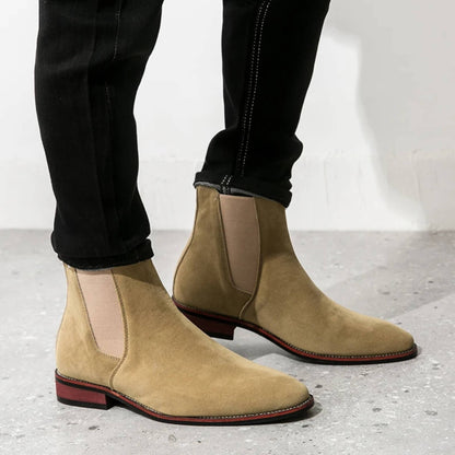 FORCIANO IVORY beige suede height increasing boots worn in a side lifestyle view with elastic Chelsea panels.