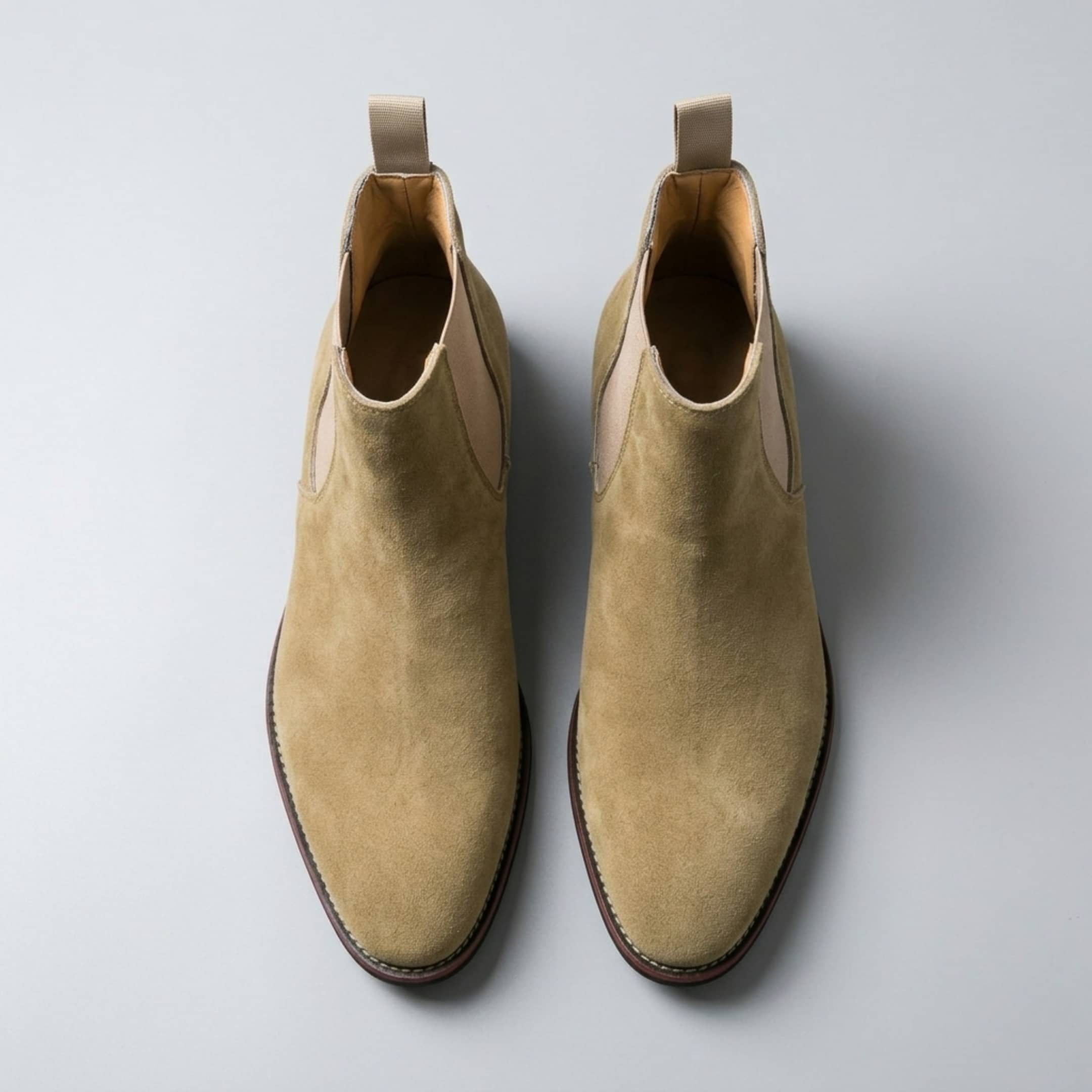 FORCIANO IVORY beige suede height increasing boots shown as a pair from a top-front view.