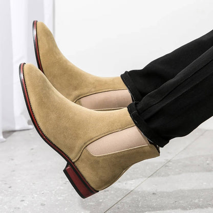 FORCIANO IVORY beige suede height increasing boots shown in a close-up worn view with elastic Chelsea panels.