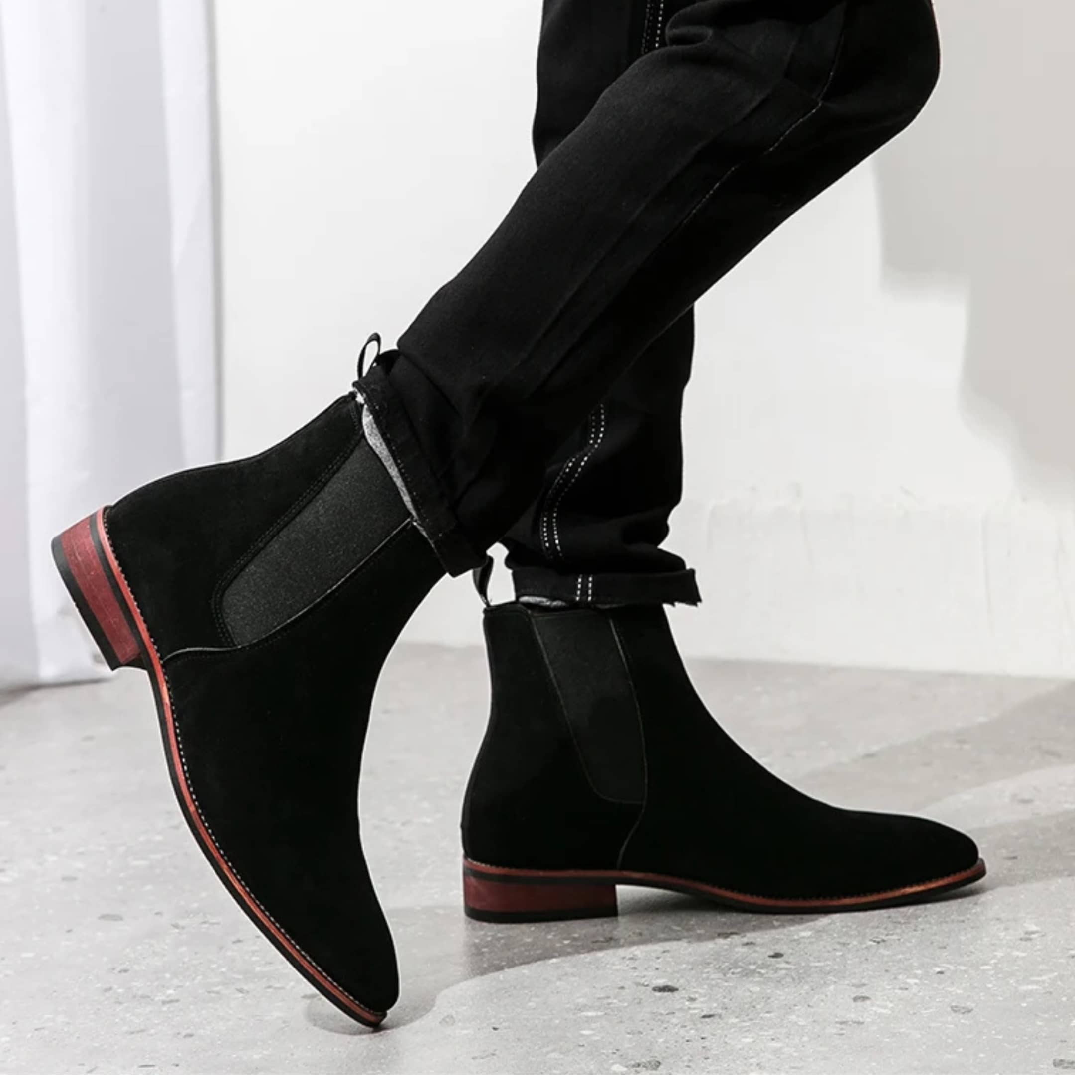 FORCIANO IVORY black suede elevator boots worn in a side lifestyle view with elastic Chelsea panels.