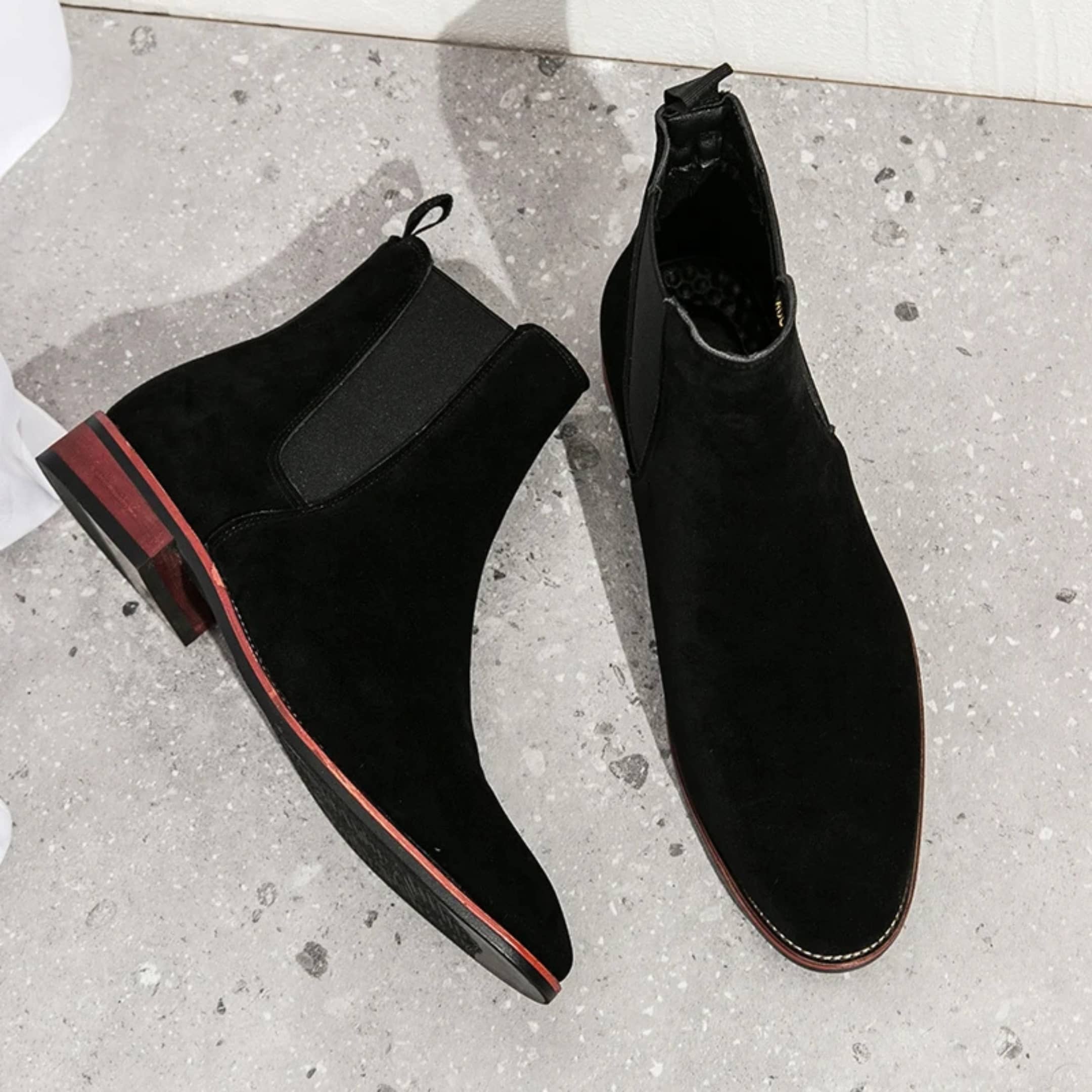 FORCIANO IVORY black suede height increasing boots shown as a pair from an angled top view.