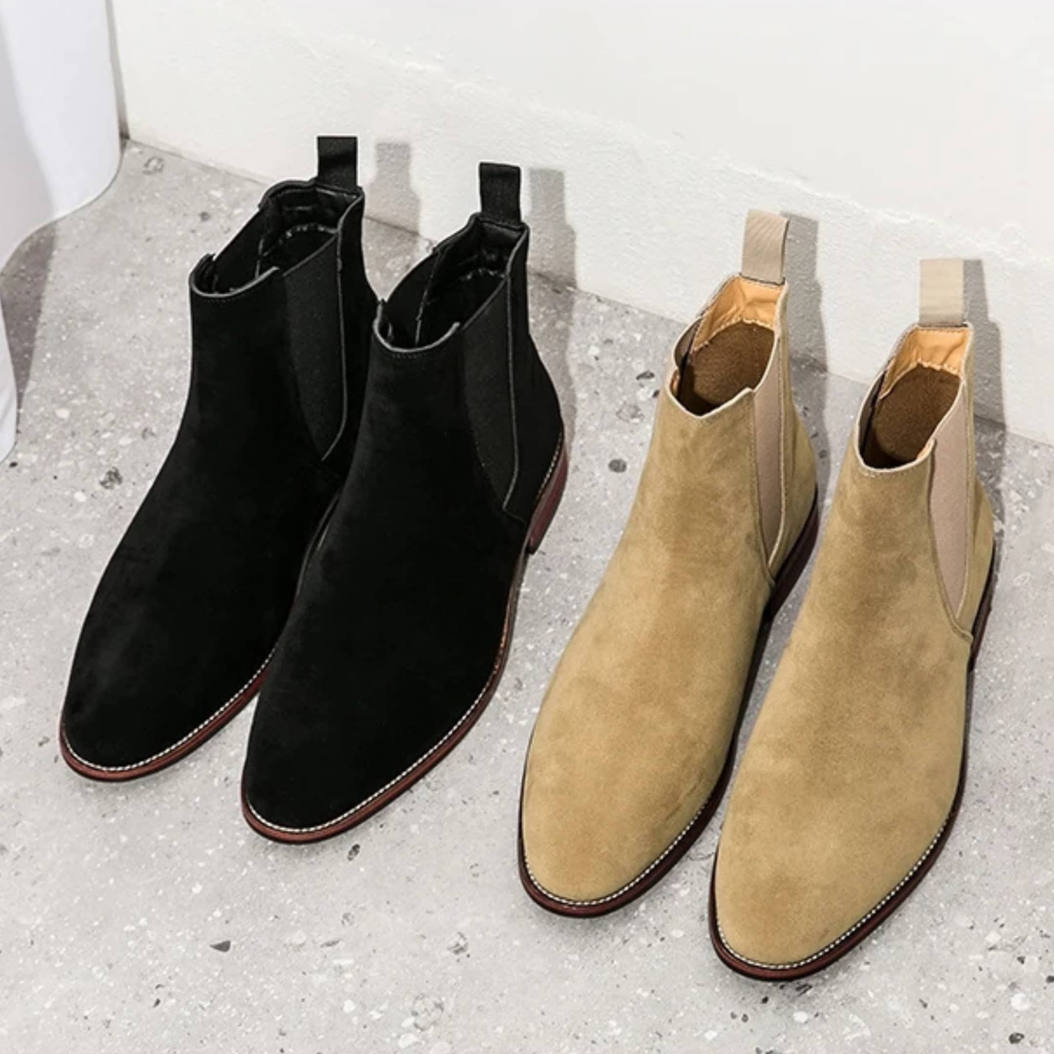 FORCIANO IVORY elevator boots shown as black and beige suede pairs from an angled top view.