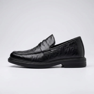 FORCIANO KINGSLEY black leather height increasing loafer shown in a clean side profile, highlighting the penny strap and slip-on design.