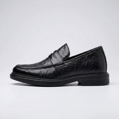 FORCIANO KINGSLEY black leather height increasing loafer shown in a clean side profile, highlighting the penny strap and slip-on design.