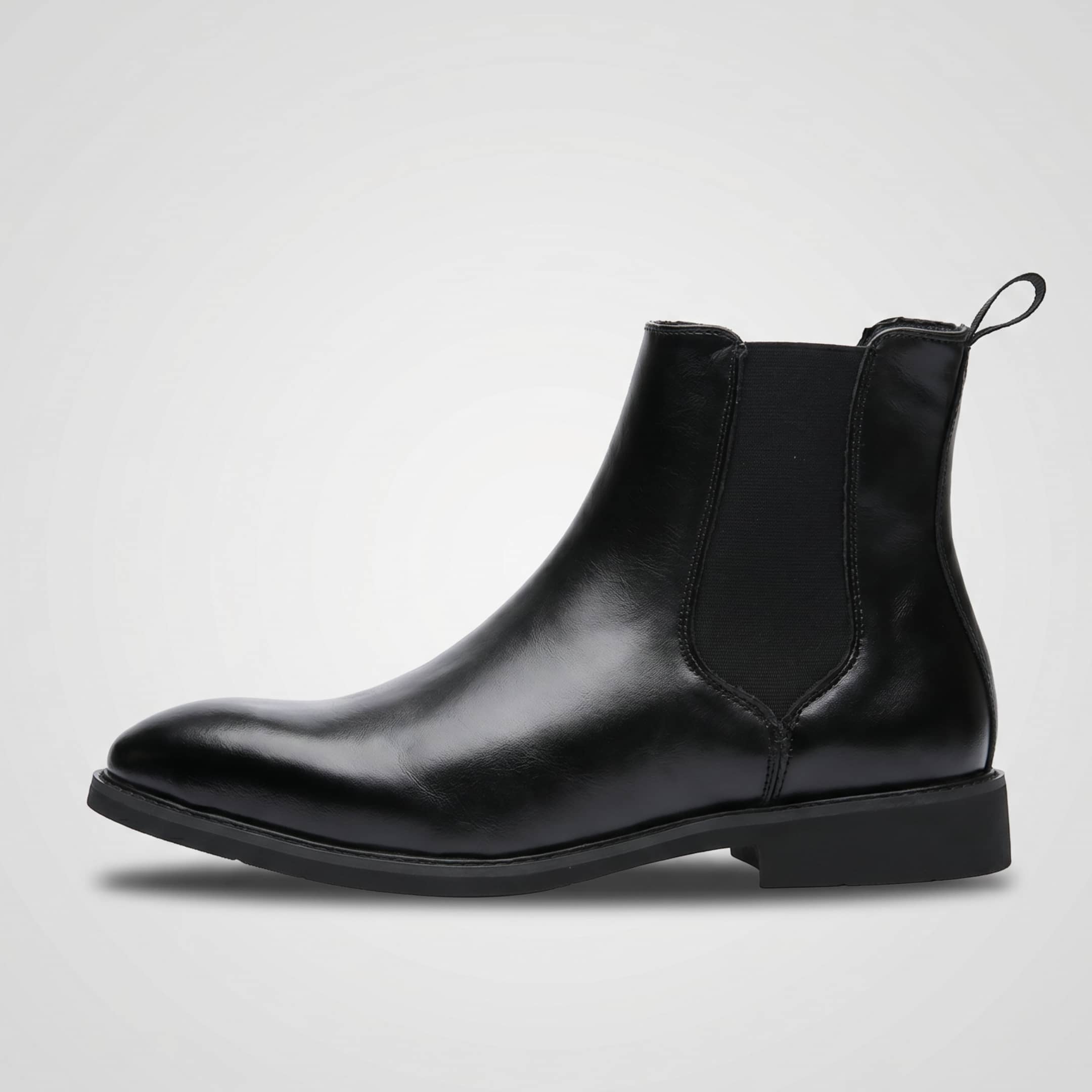 FORCIANO LUXOR black leather elevator Chelsea boots shown from the side with elastic side panels.