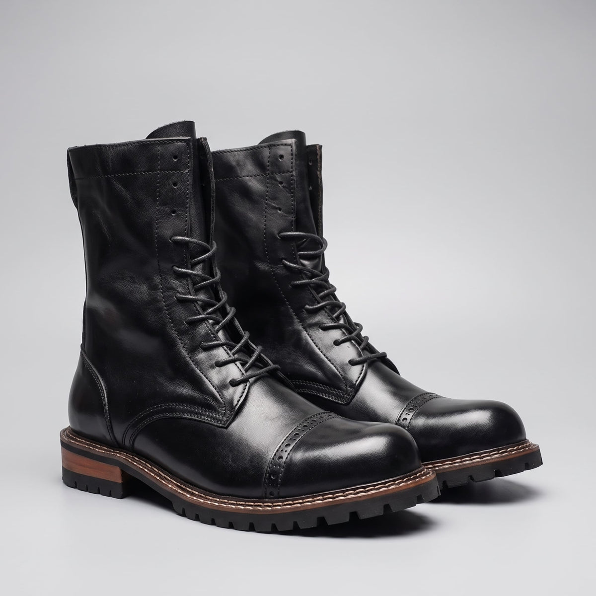 FORCIANO MARSHAL black height increasing boots with genuine leather uppers shown as a pair from a front three-quarter angle.