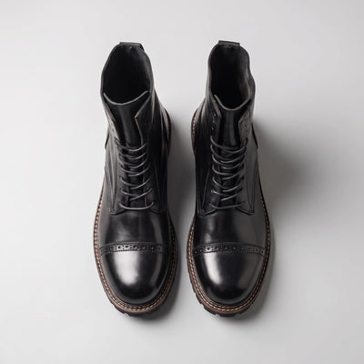 FORCIANO MARSHAL black height increasing boots with genuine leather uppers shown together from the top view.