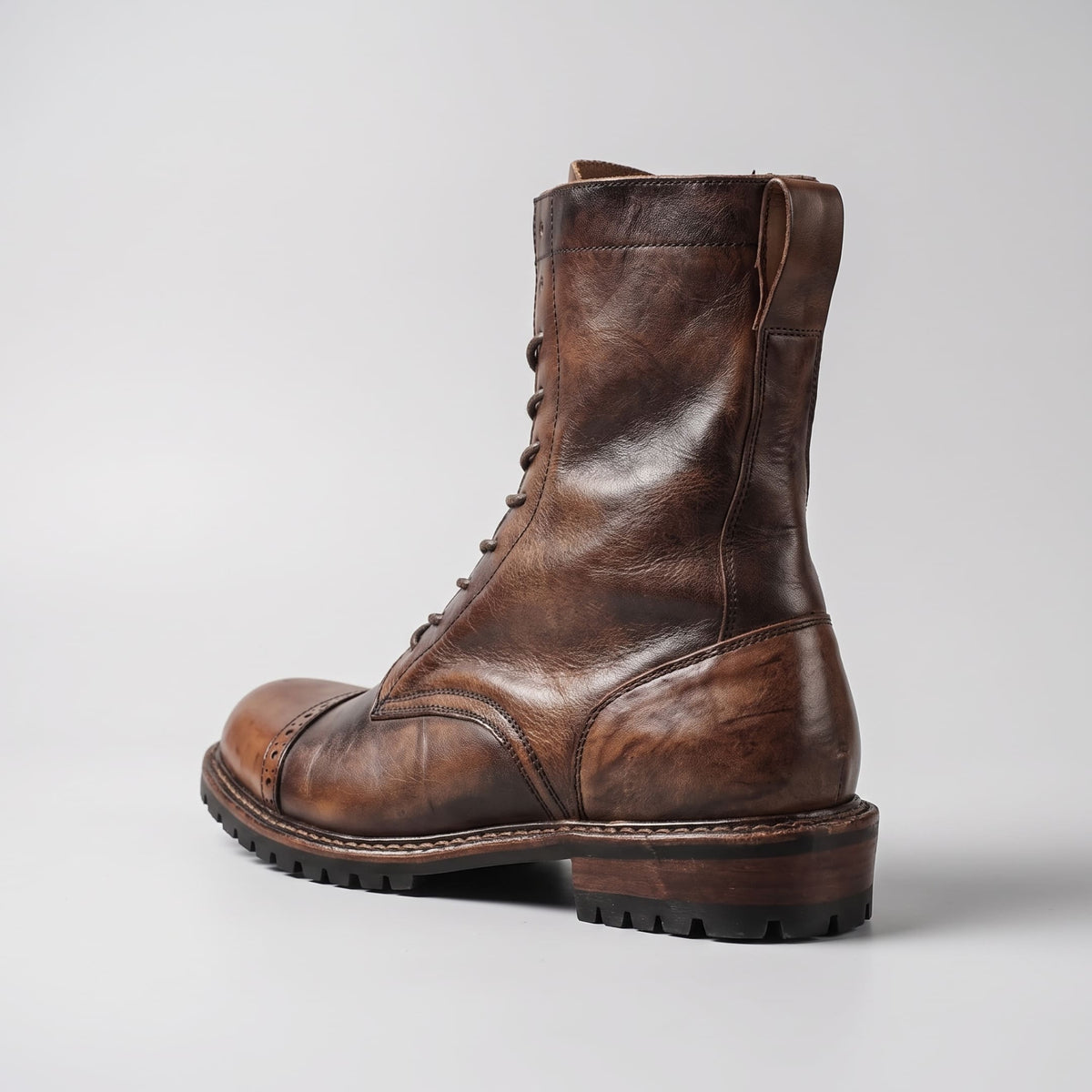 FORCIANO MARSHAL brown height increasing boots with genuine leather upper shown from a rear three-quarter angle.