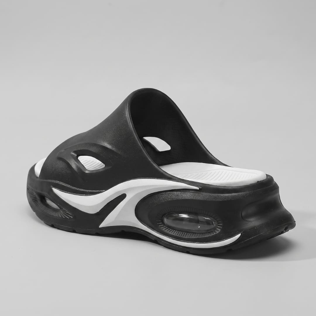 Black and white FORCIANO MAVERICK Height Increasing Shoes shown from a rear three-quarter angle with contrasting white footbed.
