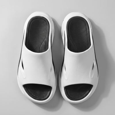 Pair of white and black FORCIANO MAVERICK Height Increasing Shoes shown from an overhead view with black textured footbeds.