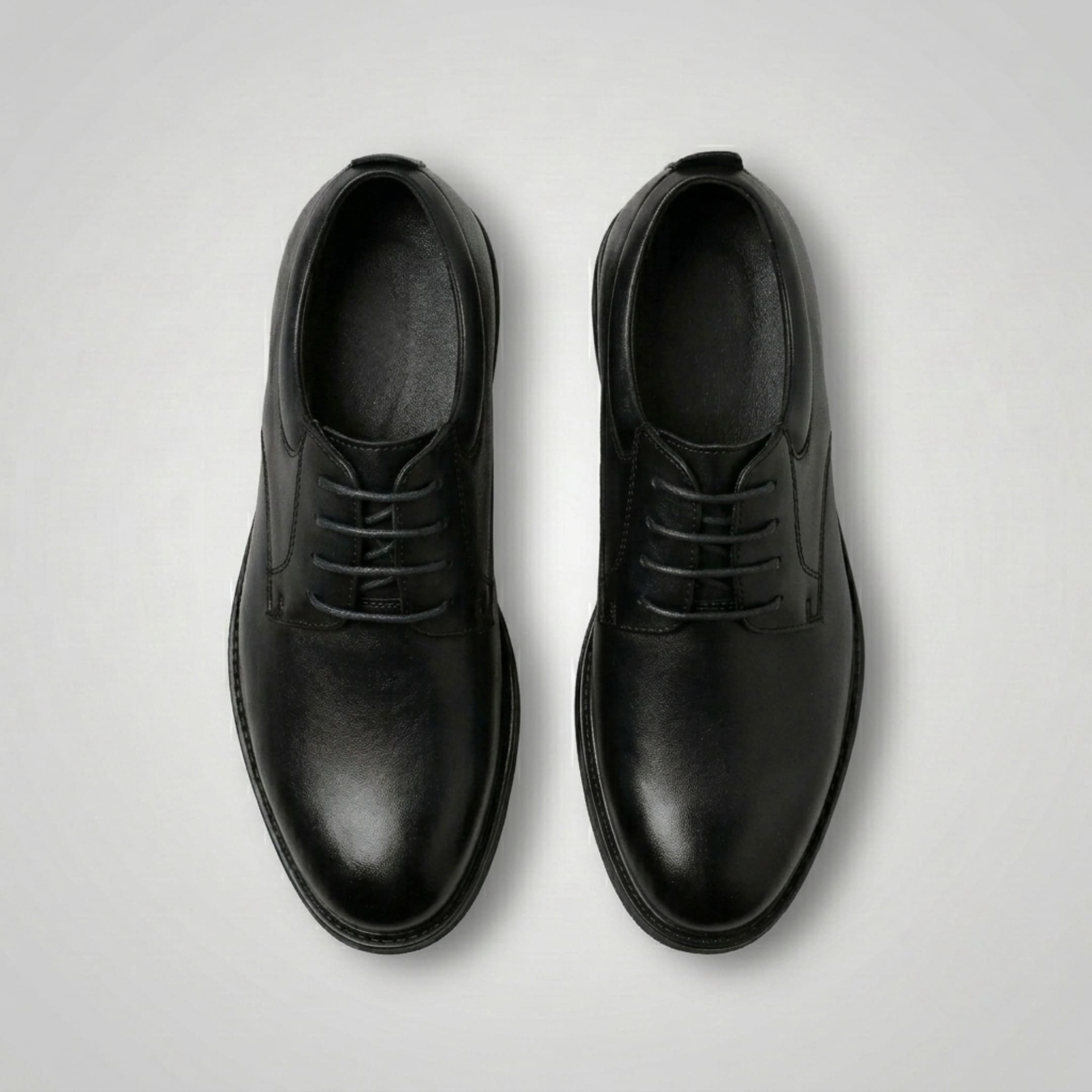 FORCIANO MOMENTUM black height increasing dress shoes shown as a pair from the top, highlighting the lace-up design.