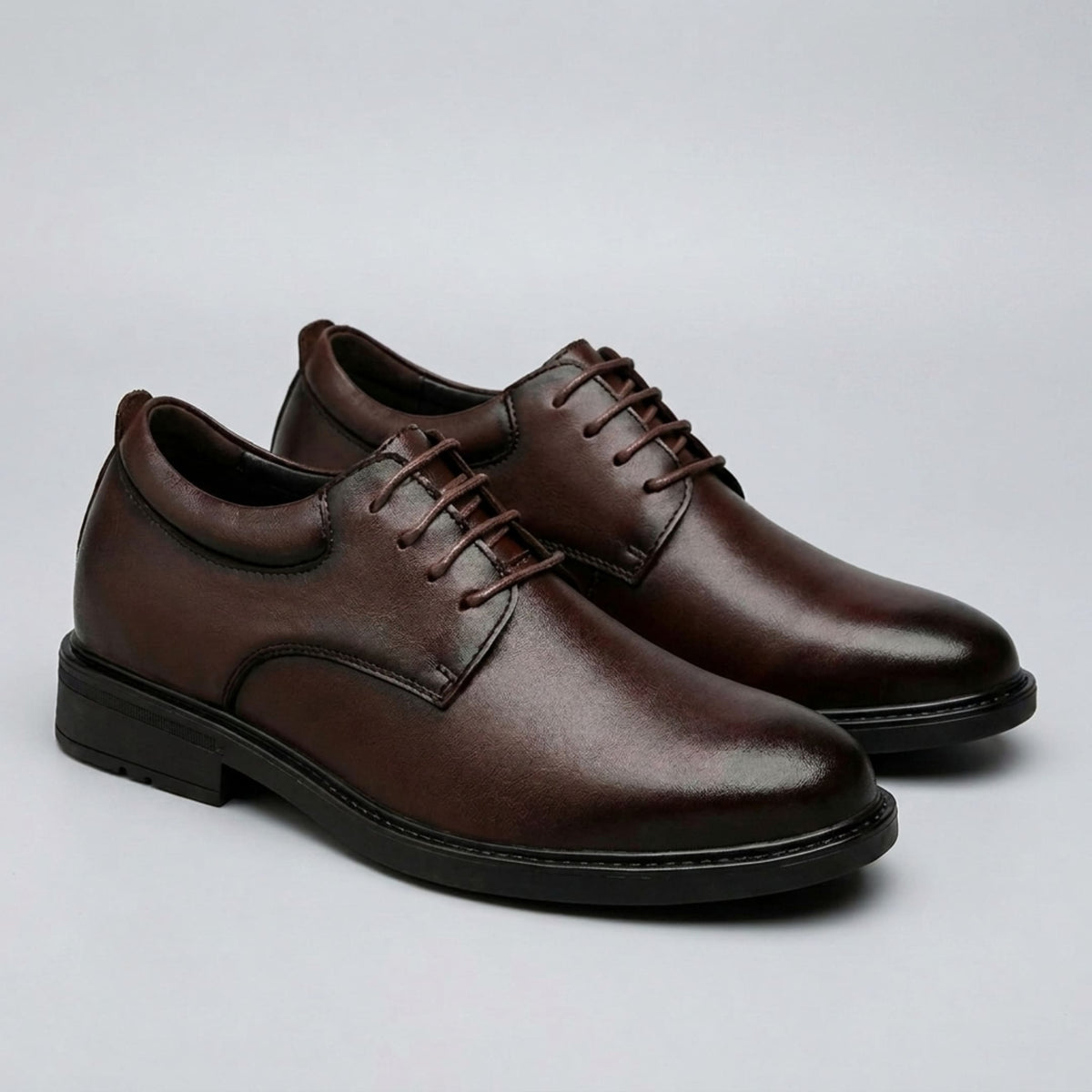 FORCIANO MOMENTUM brown Elevator Dress Shoes shown as a pair from the front three-quarter angle.