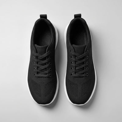FORCIANO MONACO Height Increasing Sneakers in black, top view of the pair showing air mesh uppers, black laces and white sole edges.