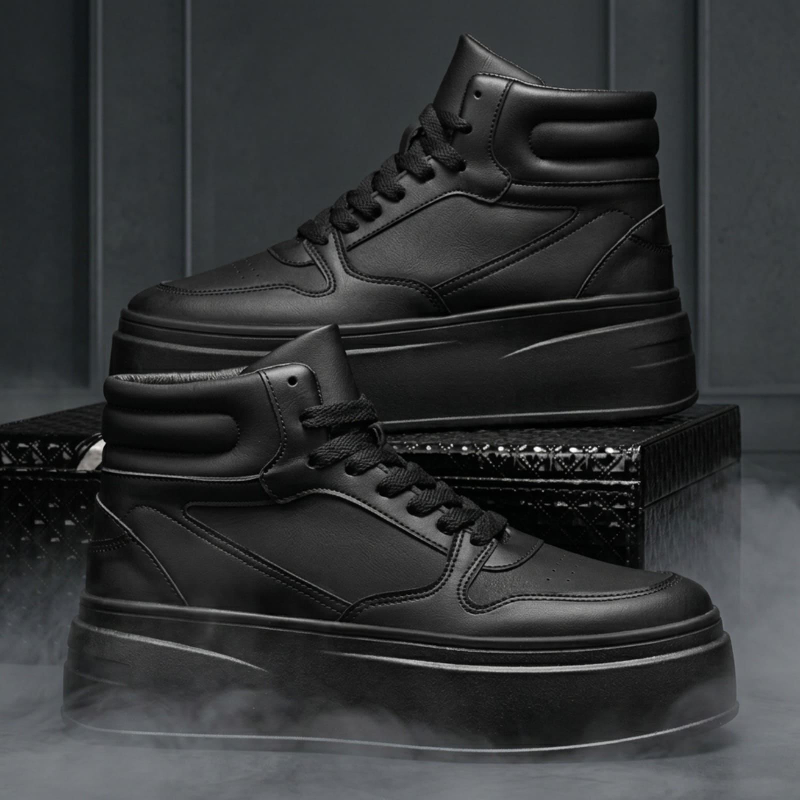 FORCIANO MONARCH black height increasing sneakers displayed as a pair in side-profile and three-quarter views on a dark studio platform.