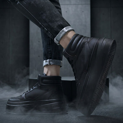 FORCIANO MONARCH black height increasing sneakers worn in a lifestyle view with one shoe raised to show the side profile and outsole.