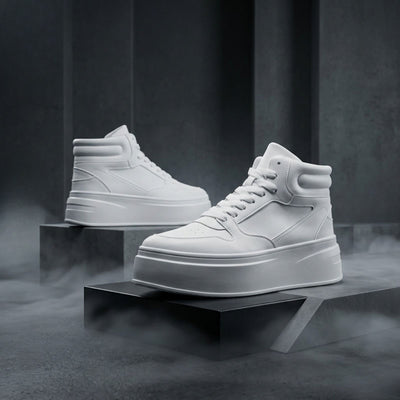 FORCIANO MONARCH white height increasing sneakers presented as a pair in side-profile and front-angle studio views on raised display blocks.