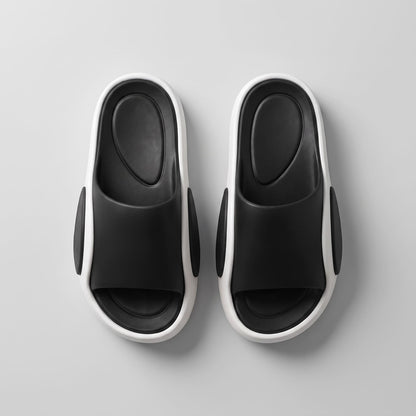 FORCIANO NEXUS black and white EVA sandals displayed as a pair from above, showing the black footbeds of the Height Boosting Shoes.
