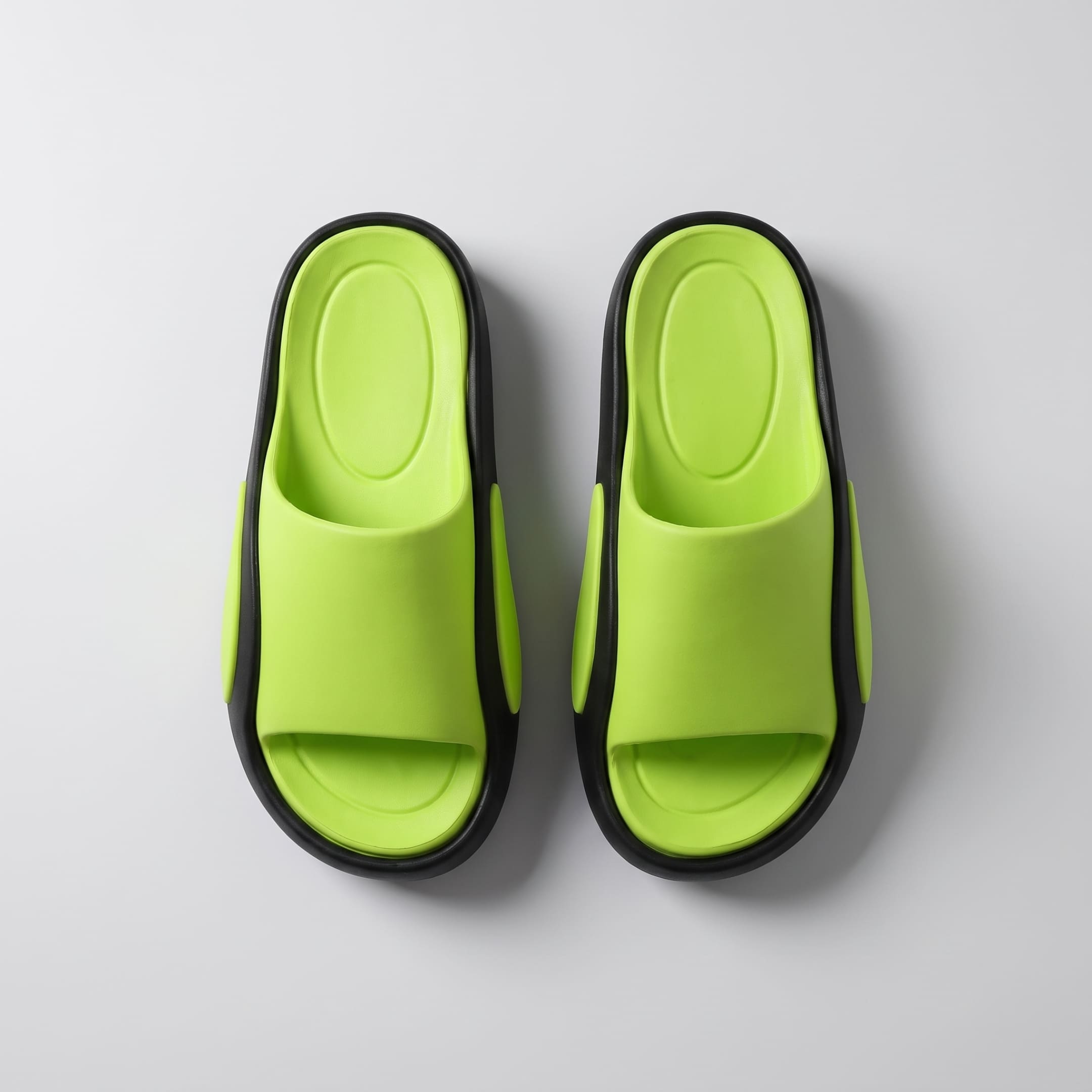 Top-down view of green and black FORCIANO NEXUS EVA sandals shown as a pair, displaying the footbeds and straps of the Height Boosting Shoes.