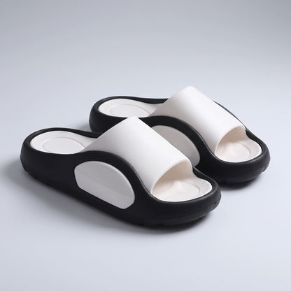 Pair of FORCIANO NEXUS white and black EVA sandals from a front three-quarter view, showing the Height Boosting Shoes and contrasting sole design.