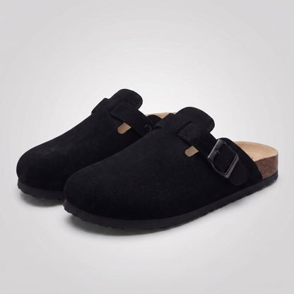 FORCIANO NOMAD black elevator slippers with premium suede uppers and buckle details, shown as a pair from a front three-quarter angle.