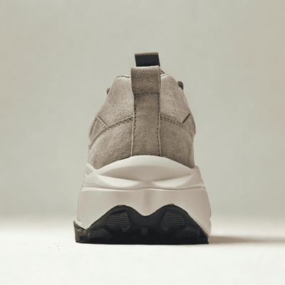 FORCIANO NORTHRIDGE beige height increasing sneakers shown from the rear, highlighting the heel pull tab, raised sole and black outsole sections.