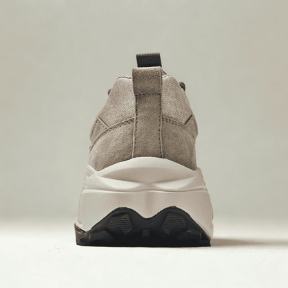 FORCIANO NORTHRIDGE beige height increasing sneakers shown from the rear, highlighting the heel pull tab, raised sole and black outsole sections.
