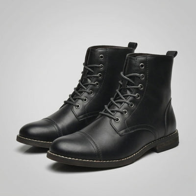 FORCIANO OUTLAW black leather height increasing boots shown as a lace-up pair from a front three-quarter angle, highlighting the cap toe and leather finish.