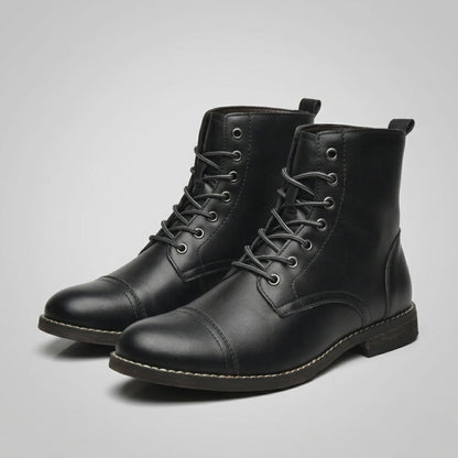 FORCIANO OUTLAW black leather height increasing boots shown as a lace-up pair from a front three-quarter angle, highlighting the cap toe and leather finish.