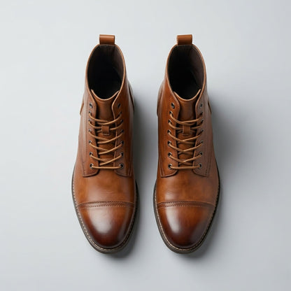 FORCIANO OUTLAW light brown leather height increasing boots shown from a top view with lace-up fronts and cap-toe detailing.