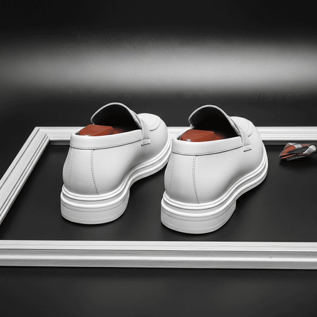 FORCIANO PANTHERA white leather elevator loafers displayed from the rear, showing both heels and layered white soles.