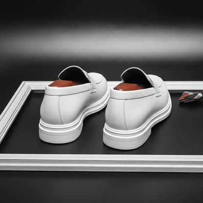 FORCIANO PANTHERA white leather elevator loafers displayed from the rear, showing both heels and layered white soles.