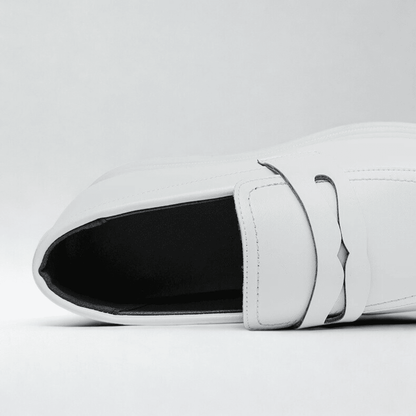 FORCIANO PANTHERA white leather elevator loafers shown in a close-up top view highlighting the opening, tongue and strap detail.