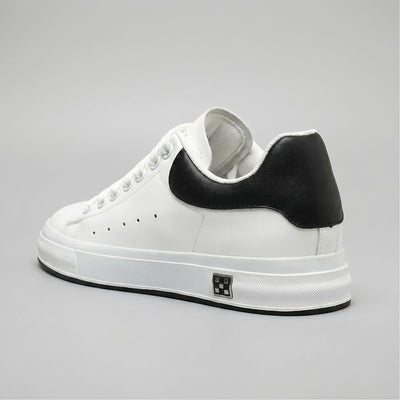 FORCIANO PORTOFINO white leather sneaker with a black heel panel, shown from a rear three-quarter angle with the raised sole profile visible.