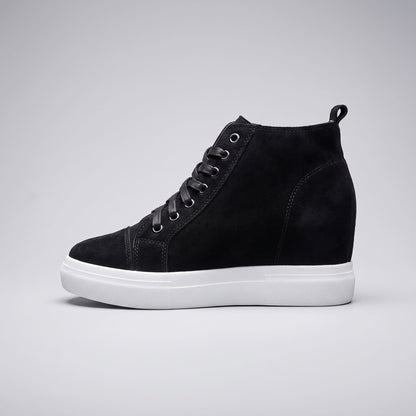 FORCIANO PRESLEY Black sneakers for Women shown from the side with premium suede leather upper, concealed wedge silhouette, metal eyelets and white sole.