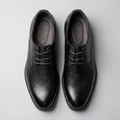 Pair of black Crocodile-style FORCIANO PRESTIGE Height Increasing Shoes shown from the top view.