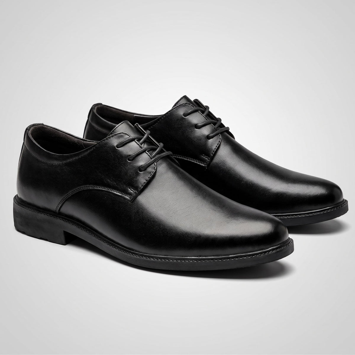 Pair of black Sleek-style FORCIANO PRESTIGE Height Increasing Shoes displayed from a front three-quarter angle.