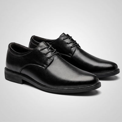 Pair of black Sleek-style FORCIANO PRESTIGE Height Increasing Shoes displayed from a front three-quarter angle.